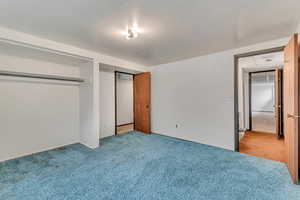 Unfurnished bedroom with carpet