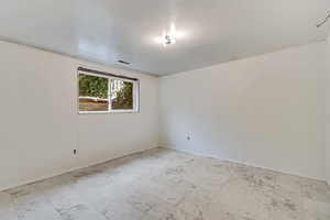 Unfurnished room featuring laminate flooring,