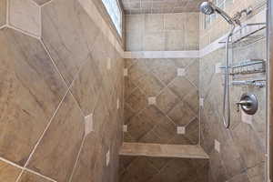 Bathroom with tiled shower