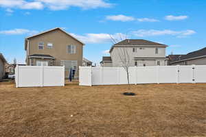 View of yard with a gate and a fenced backyard