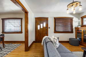 Entryway featuring wood finished floors and baseboards