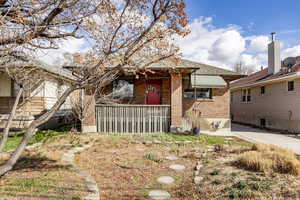 View of front of house featuring brick siding