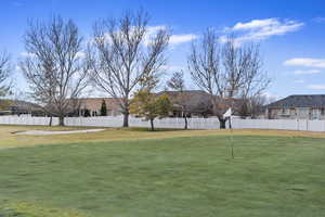 View of yard featuring fence