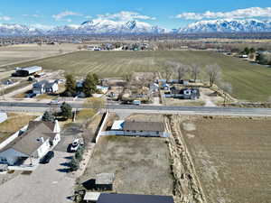 Birds eye view of property featuring a rural view, a residential view, and a mountain view