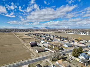 Birds eye view of property with a residential view and a mountain view