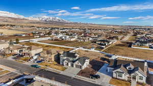 Birds eye view of property with a mountain view and a residential view