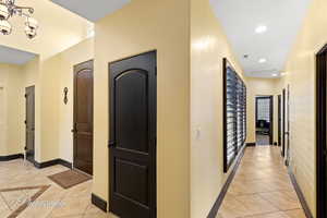 Hall with light tile patterned floors