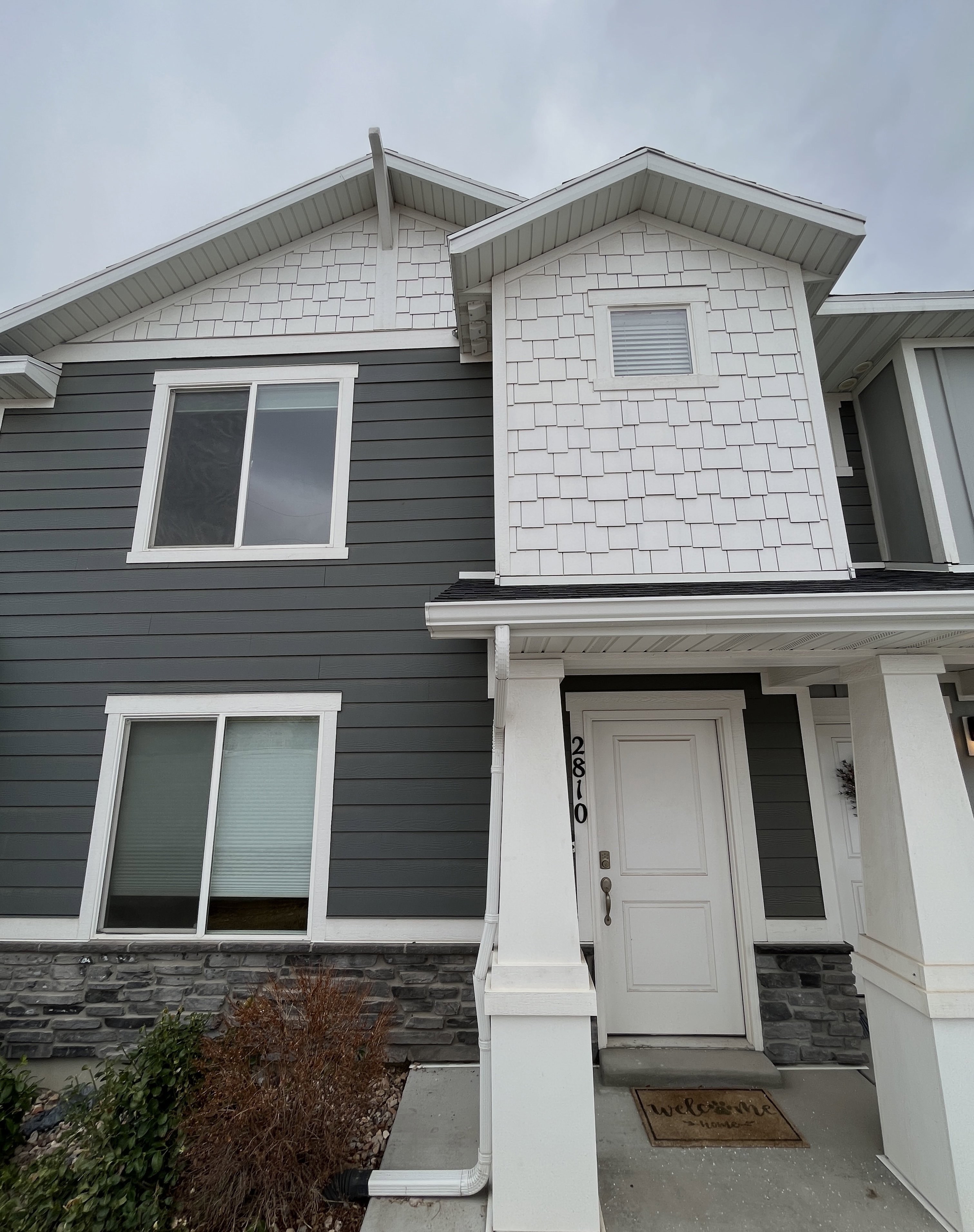View of front of house with stone siding