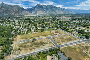 Aerial view of property's location with a mountainous background and property parcel outlined