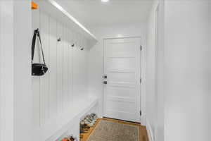 Mudroom with wood finished floors