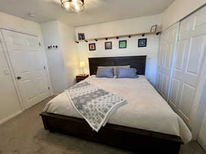 Bedroom with carpet and baseboards