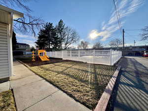 View of yard with fence and playground community