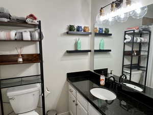 Half bath with vanity and toilet