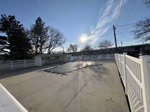 View of pool featuring fence