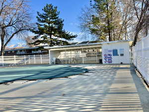 View of swimming pool with fence