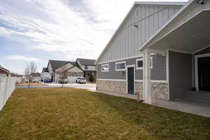 View of yard featuring fence and a residential view