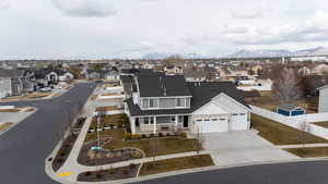 Birds eye view of property with a residential view and a mountain view