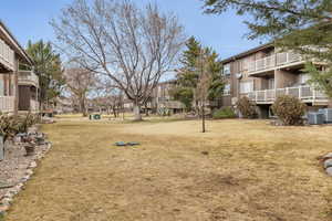View of property's community with a yard and a residential view