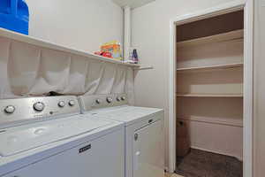 Laundry room with laundry area and washing machine and clothes dryer