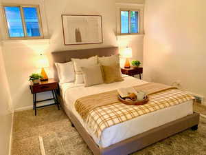 Bedroom with baseboards and carpet flooring