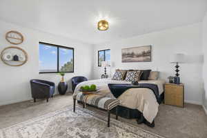 Bedroom with carpet and baseboards