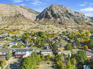 Birds eye view of property with a residential view and a mountain view