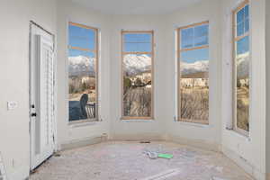 Primary bedroom w/ balcony entrance and insane view