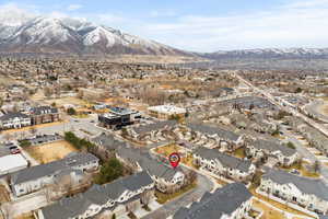 Birds eye view of property with a residential view and a mountain view
