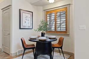 Dining room featuring visible vents and baseboards