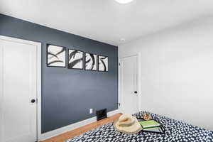 Interior space featuring light wood-type flooring, visible vents, and baseboards