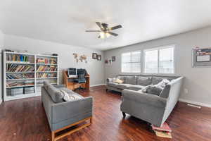 Living area featuring ceiling fan, wood finished floors