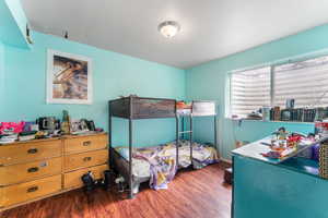 Bedroom featuring wood finished floors