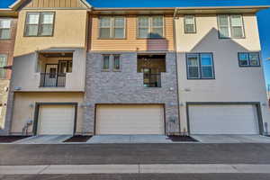 View of front of house featuring board and batten siding and a garage