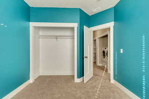 Closet with visible vents and washer and dryer