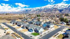 Drone / aerial view featuring a mountain view and a residential view