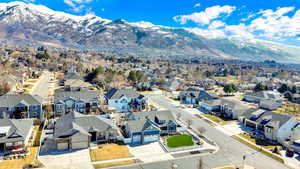 Birds eye view of property with a mountain view and a residential view