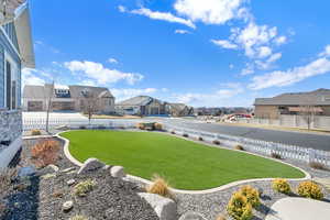 View of yard with a fenced backyard and a residential view