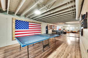 Recreation room with wood finished floors