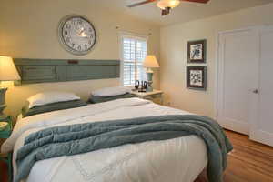 Bedroom featuring a ceiling fan and wood finished floors