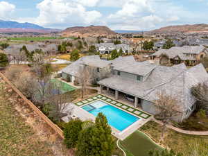 View of pool with a residential view, a patio area, a fenced backyard, and a mountain view