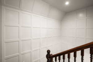 Interior space with a decorative wall and recessed lighting