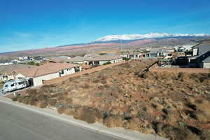 Property view of mountains with a residential view