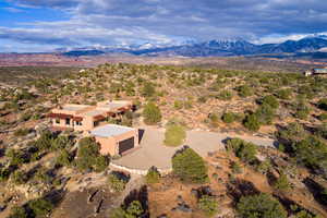 Birds eye view of property with a mountain view