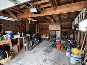 Garage featuring a garage door opener