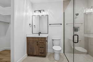 Full bathroom with vanity and a shower stall