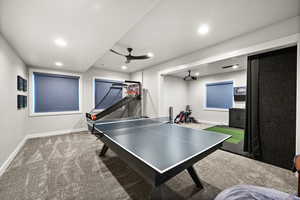 Recreation room featuring ceiling fan, recessed lighting, carpet, and baseboards