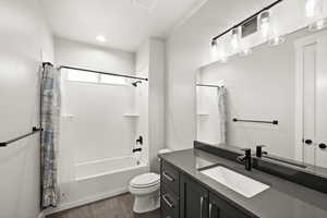 Bathroom featuring shower / bath combination with curtain, visible vents, vanity, and toilet