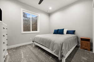 Carpeted bedroom featuring visible vents, baseboards, ceiling fan, and recessed lighting