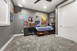 Carpeted bedroom featuring recessed lighting, a ceiling fan, and baseboards