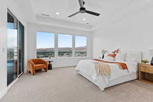Bedroom featuring access to exterior, light carpet, recessed lighting, a raised ceiling, and ceiling fan